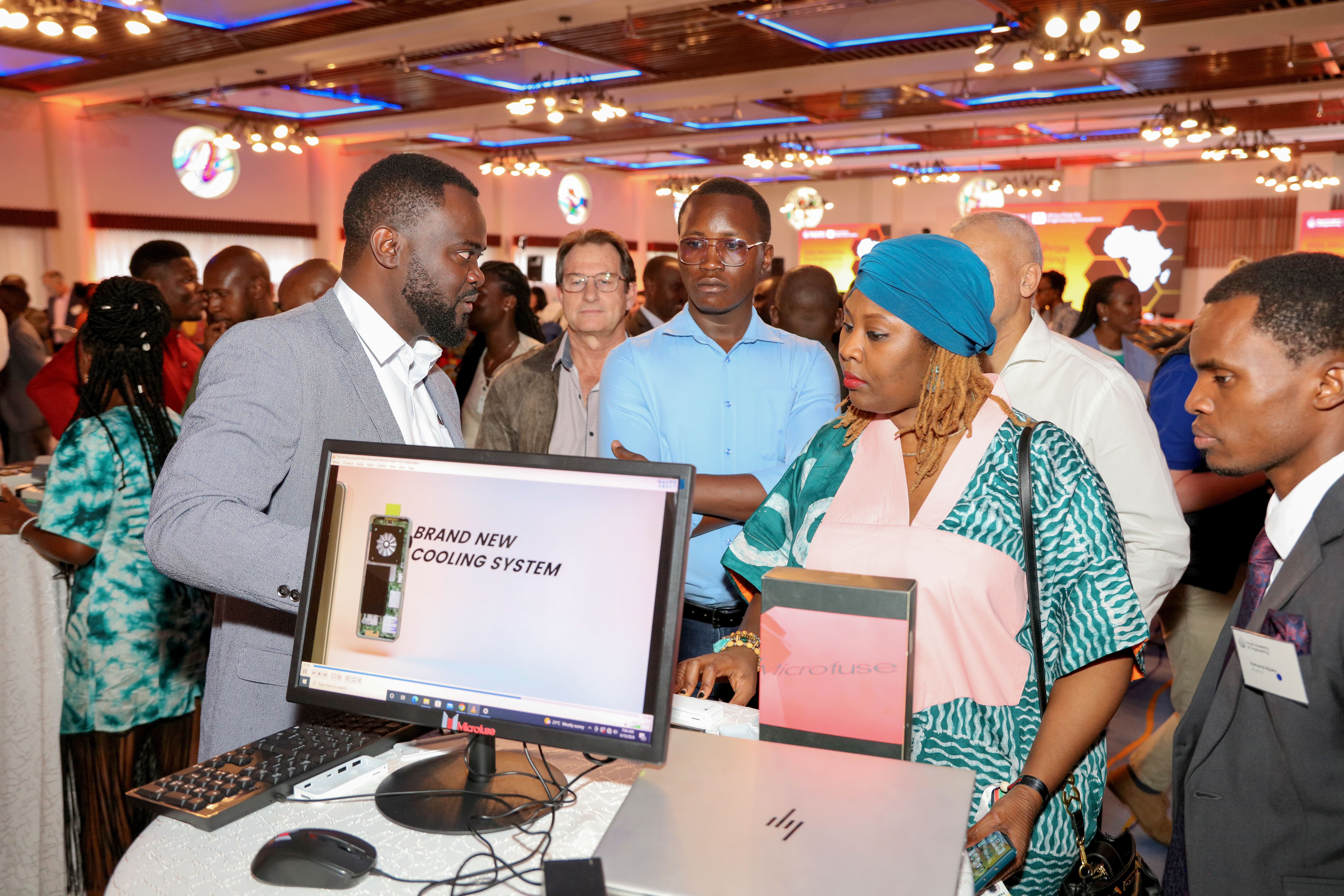 Alumna of the Africa Prize, Ivan Karugaba, from Uganda, showcasing his product, Microfuse Stick Computer